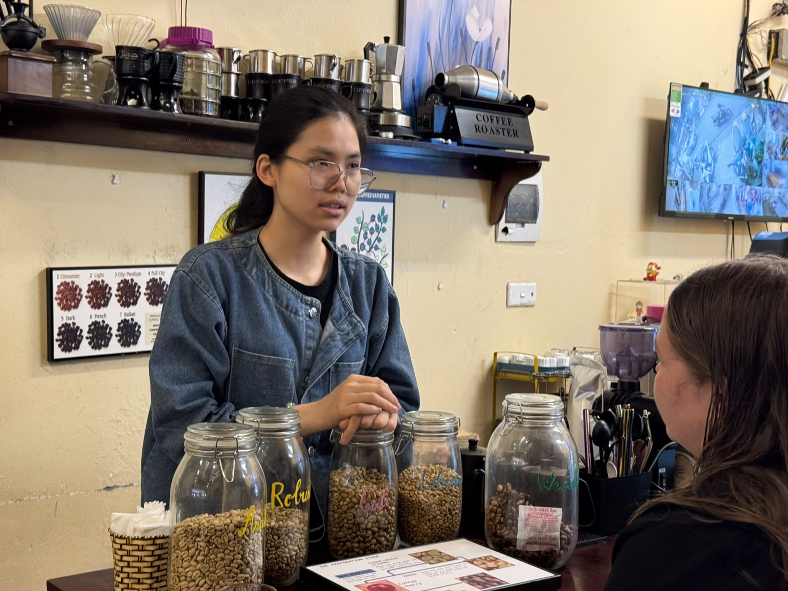 Barista explaining coffee beans